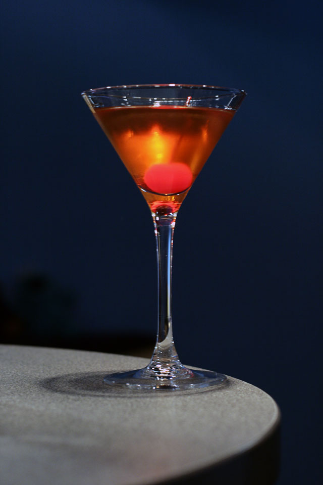 Martinez Cocktail garnished with a cocktail cherry